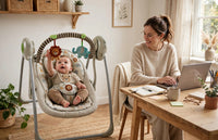 Thumbnail for Ingenuity Portable Baby Swing beside mom's desk
