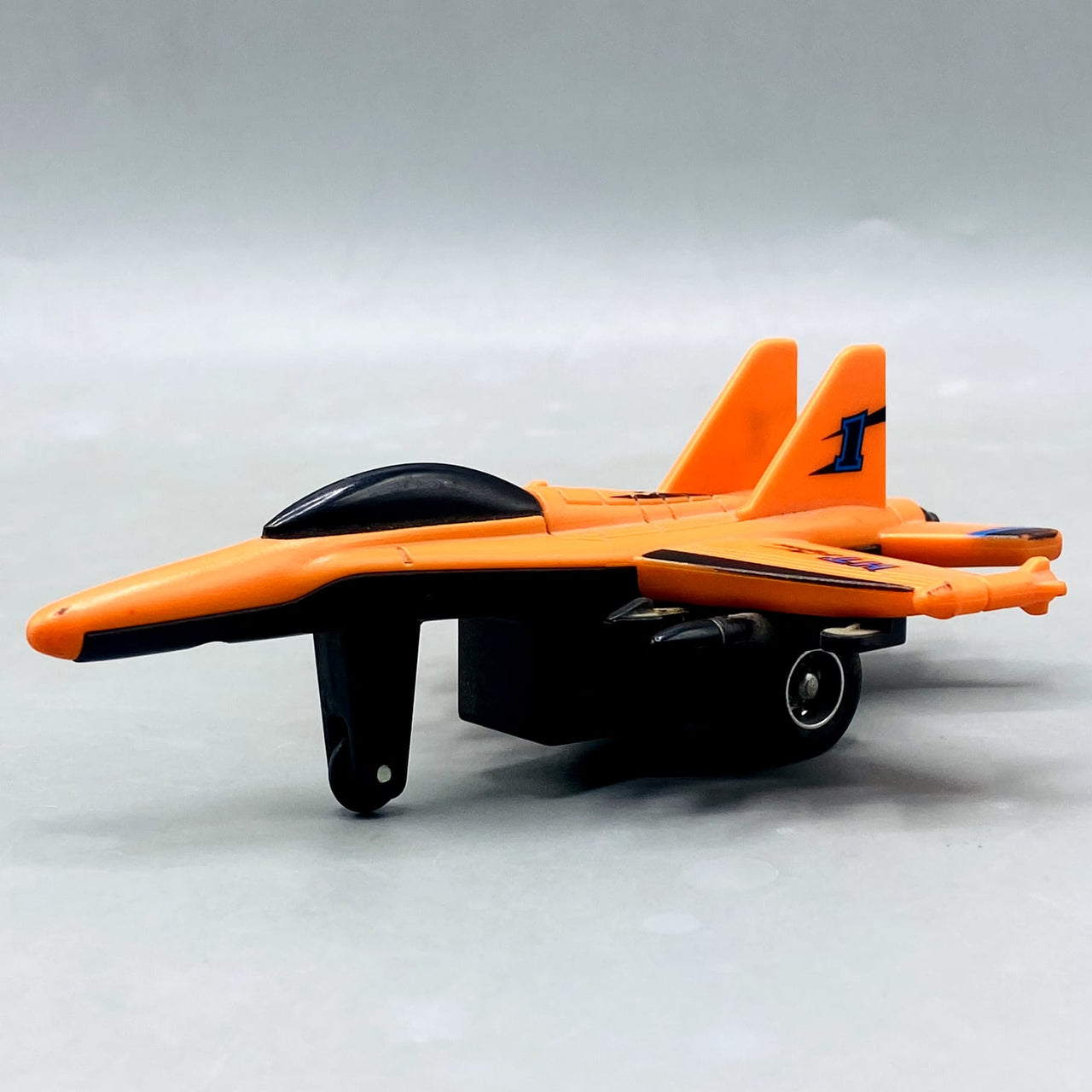 🚀 Orange "HT Fighter" Die-Cast/Plastic Jet with Missile Details