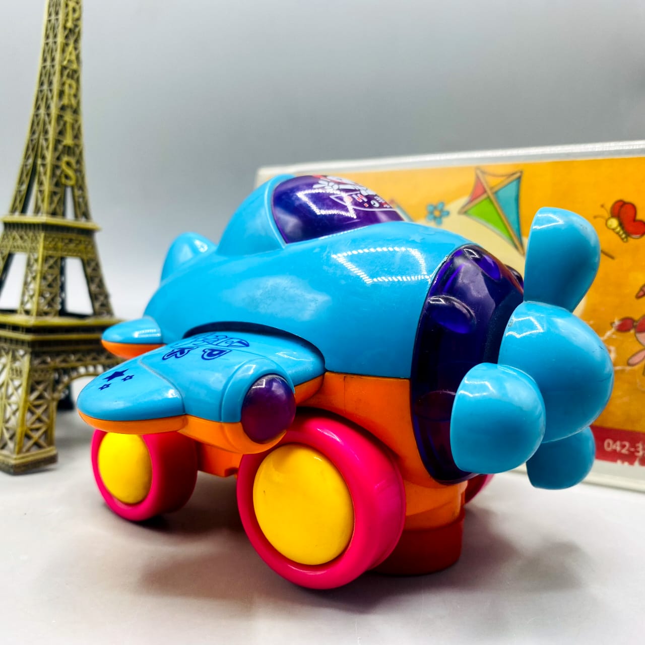 Bright Neon Propeller Airplane Push-and-Go Toy with Lights & Sound