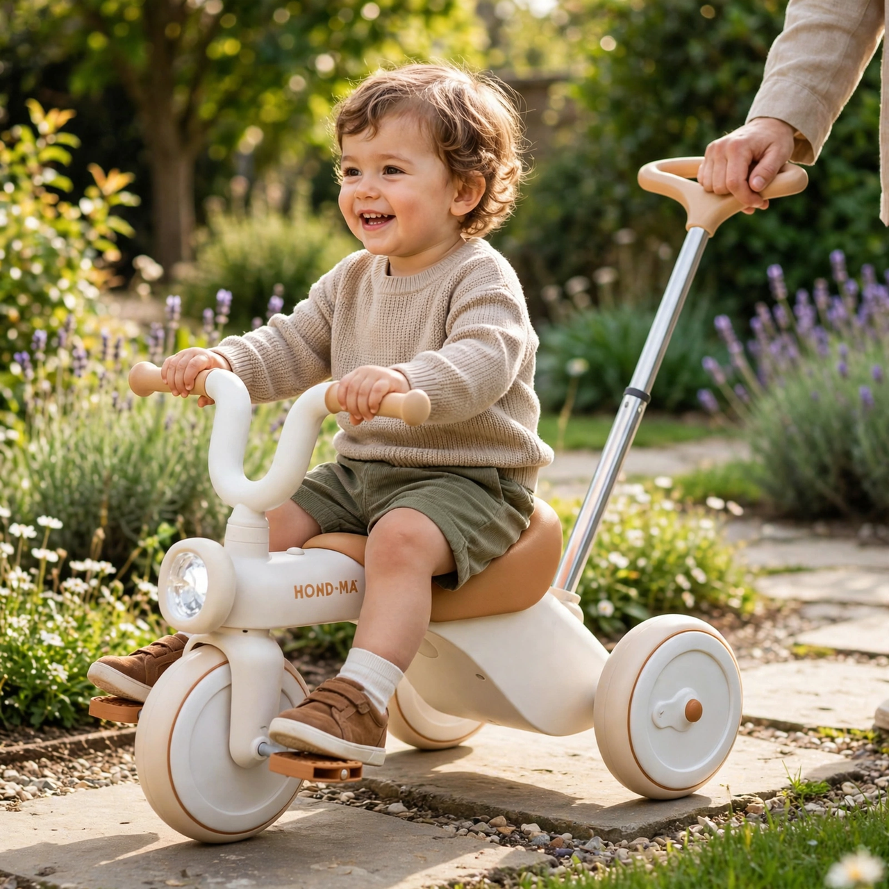 Children's Musical Light-Up Tricycle - parent pushing in garden