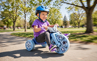 Thumbnail for Child riding the Frozen Junior Cruiser tricycle in a park