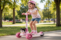 Thumbnail for Little girl riding the Lovely Pink Doll Scooty in a sunny park
