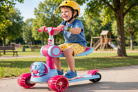 Thumbnail for Little boy sitting on the seat riding the Lovely Blue Elephant Scooty in a sunny park