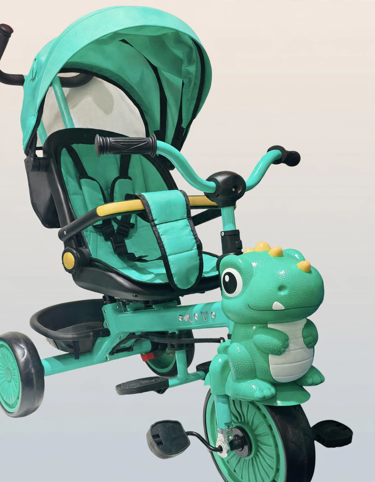 Tricycle stroller canopy and dinosaur front, studio shot