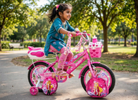 Thumbnail for Little girl riding the pink Barbie 16-inch bicycle in a park