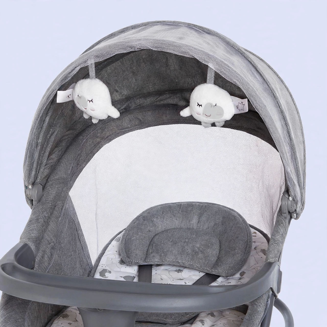 Canopy with hanging cloud toys and mosquito net